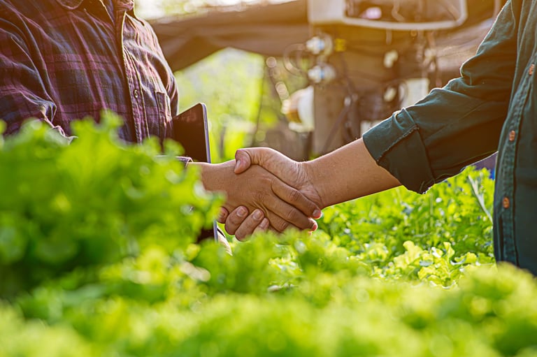 Handshaking between farmer and customer for business partnership
